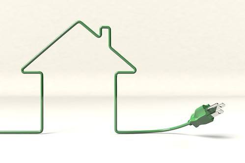 the outline of a house is drawn with green three prong electrical cable